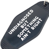 Something Ain't Right Hot Stamped Motel Keychain