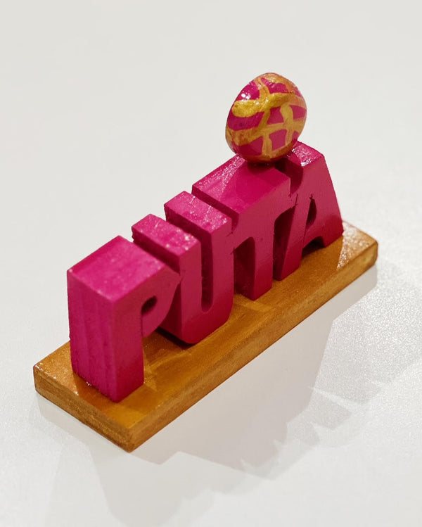 handmade wood pink "Puta" sign with concha on it from Sew Bonita 